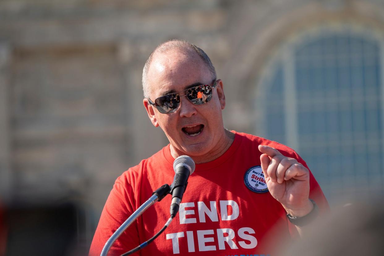 UAW President Shawn Fain talks to a crowd following the Labor Day parade Roosevelt Park in front of the Michigan Central Station in Detroit on Monday, Sept. 4, 2023.