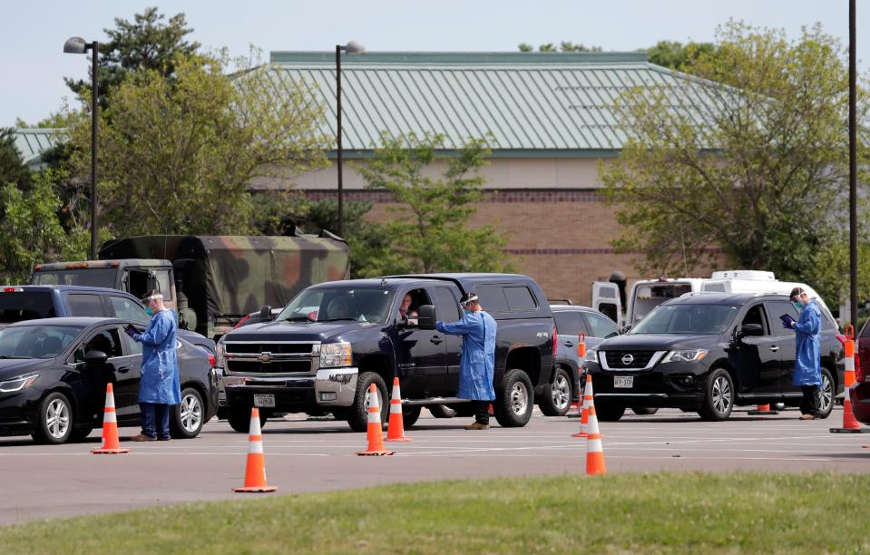 Long lines are on hand at a community COVID-19 testing site at the University of Wisconsin-Oshkosh, Fox Cities Campus Wednesday, August 5, 2020, in Menasha, Wis.