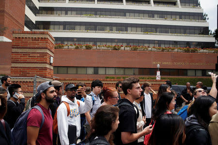 Students walk past the engineering building as they leave campus after police officers conducted a search at the University of California, Los Angeles (UCLA) campus after it was placed on lockdown following reports of a shooter that left 2 people dead in Los Angeles, California June 1, 2016. REUTERS/Patrick T. Fallon