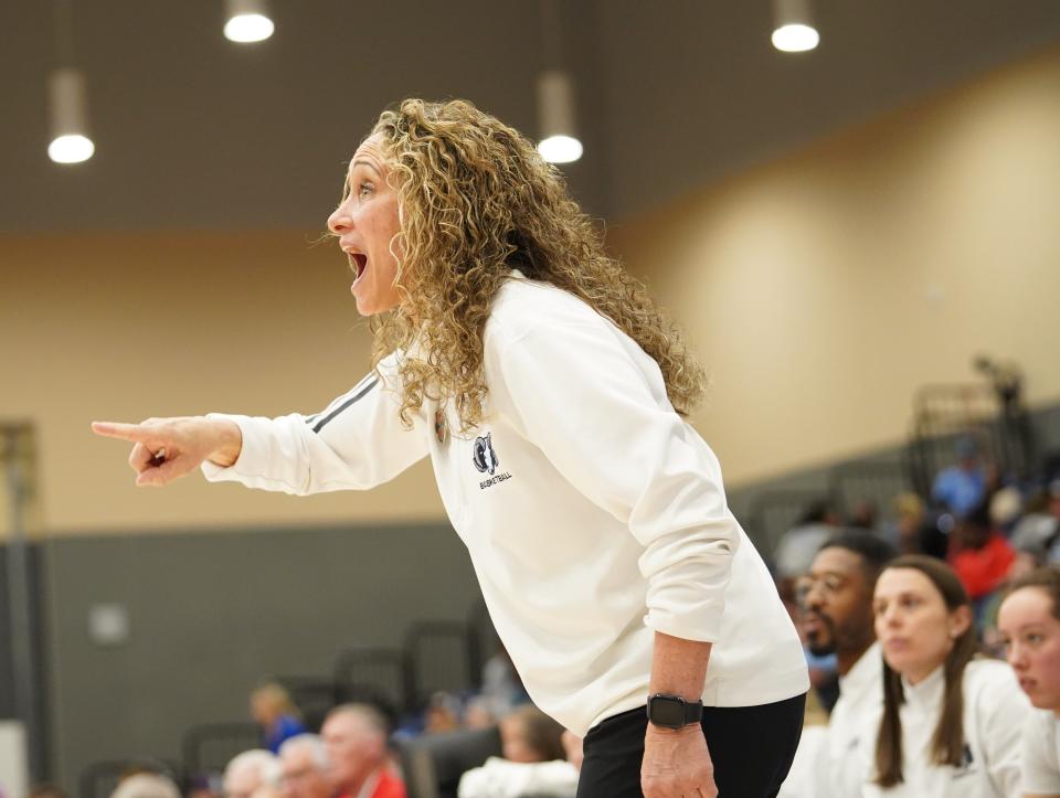 URI head coach Tammi Reiss shouts instructions during Saturday's semifinal matchup with St. Louis.