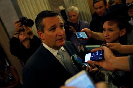 Senator Ted Cruz (R-TX) speaks with reporters after the failure of the "skinny repeal" health care bill on Capitol Hill in Washington, U.S., July 28, 2017. REUTERS/Aaron P. Bernstein/Files