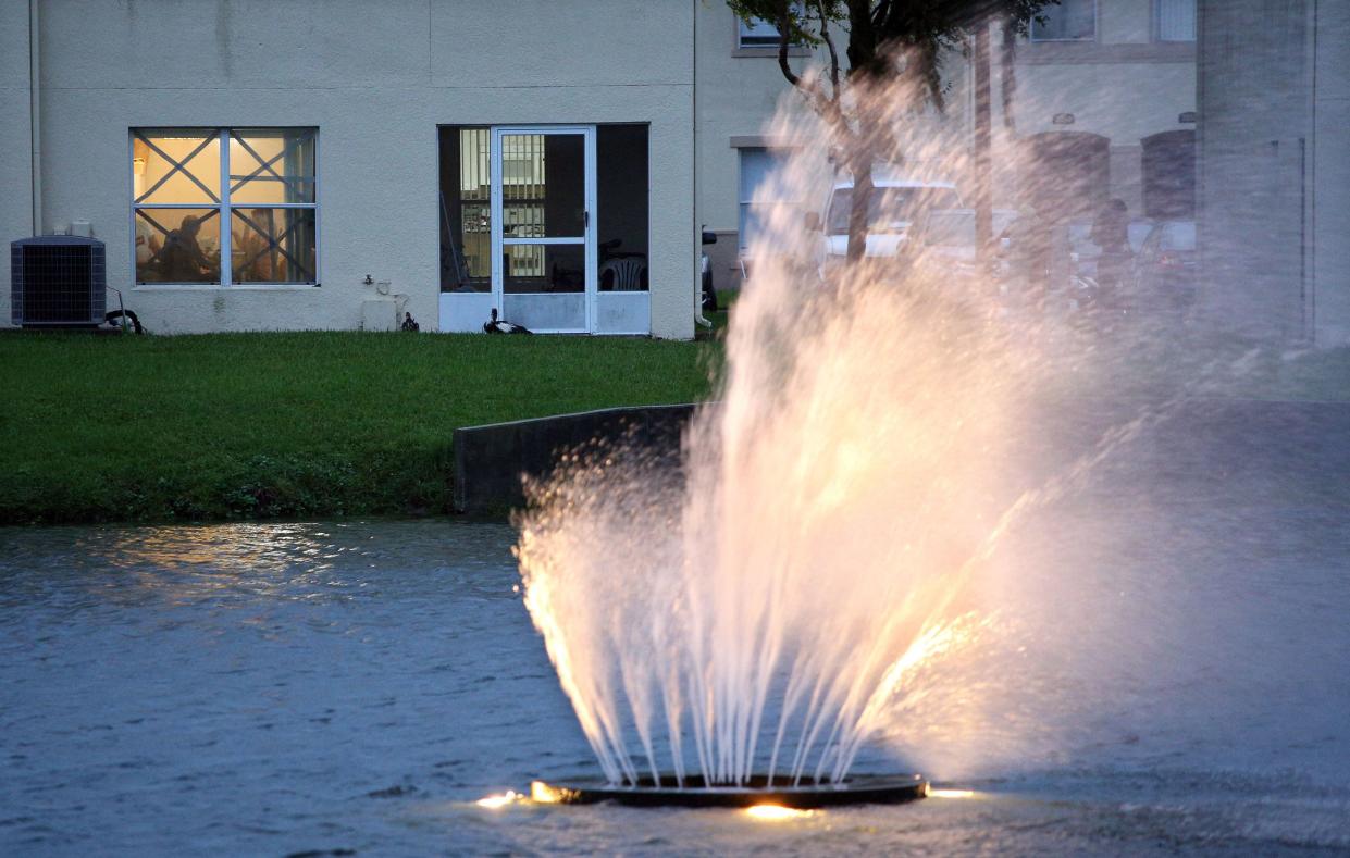 A fountain inside a condominium blows almost horizontal as residents tape their windows for alleged security south of Orlando, Fla. on Sept. 28, 2022. Hurricane Ian slammed into the coast of southwest Florida as a monster Category 4 storm on Sept. 28, 2022, bringing "catastrophic" storm surges, wind and flooding as officials readied a huge emergency response.