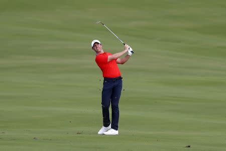 Jan 4, 2019; Maui, HI, USA; PGA golfer Rory McIlroy chips on the 18th hole during the second round of the Sentry Tournament of Champions golf tournament at Kapalua Resort - The Plantation Course. Mandatory Credit: Brian Spurlock-USA TODAY Sports