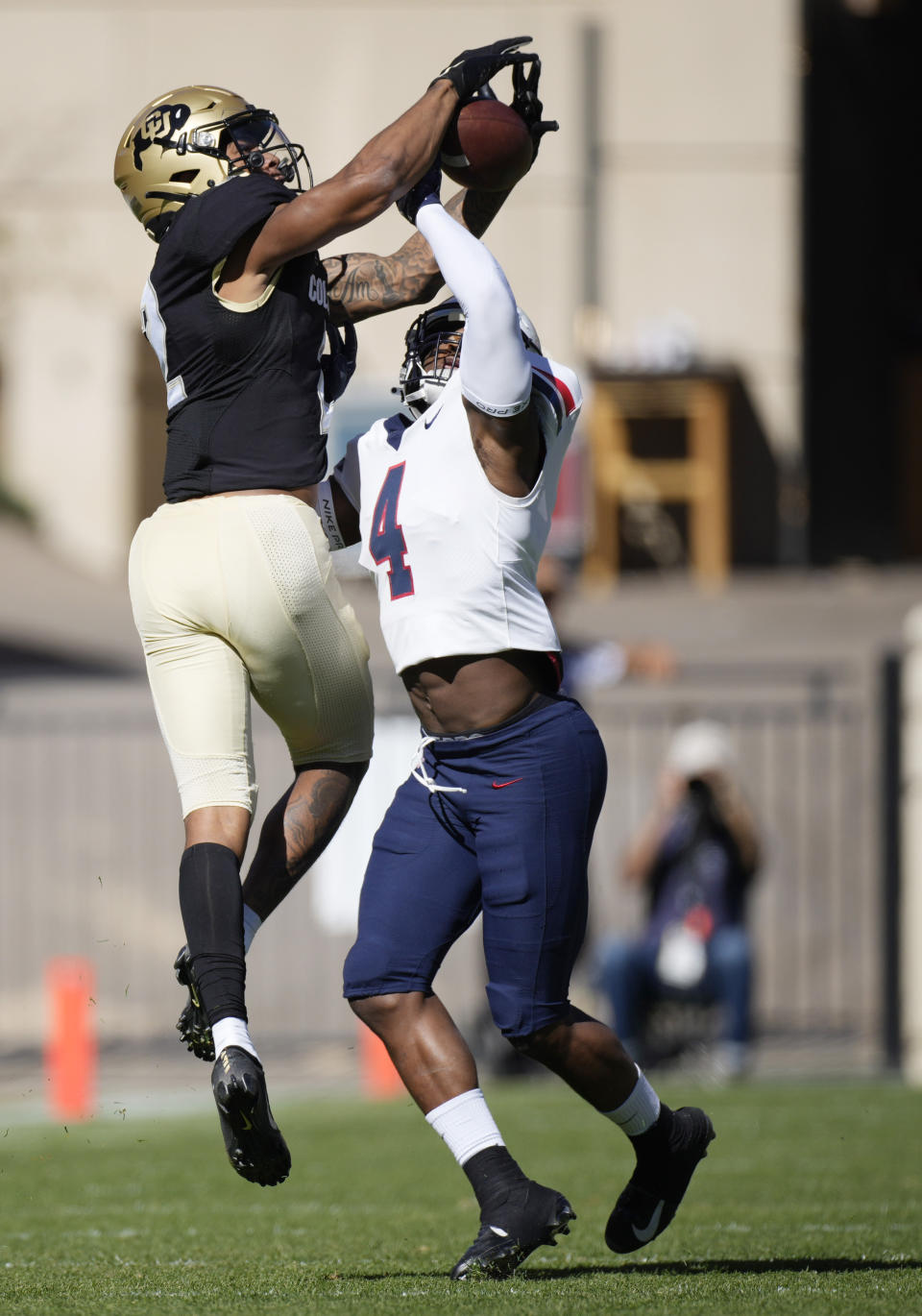 Colorado wide receiver Brenden Rice, left, pulls in a pass for a long gain over Arizona cornerback Christian Roland-Wallace in the first half of an NCAA college football game Saturday, Oct. 16, 2021, in Boulder, Colo. (AP Photo/David Zalubowski)