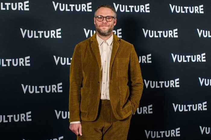 Seth poses for photographs at a red carpet event