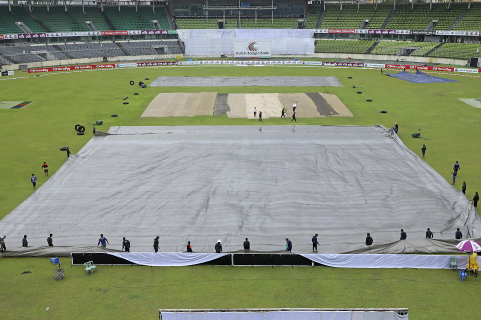 The pitch is seen covered as rain delays play on the third day of the second test cricket match between Bangladesh and New Zealand in Dhaka, Bangladesh, Friday, Dec. 8, 2023. (AP Photo/Mosaraf Hossain)