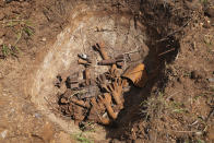 Remnants of cluster munitions are seen at a clearance site in Ayii, Eastern Equatoria state, in South Sudan Thursday, May 11, 2023. As South Sudanese trickle back into the country after a peace deal was signed in 2018 to end a five-year civil war, many are returning to areas riddled with mines left from decades of conflict. (AP Photo/Sam Mednick)