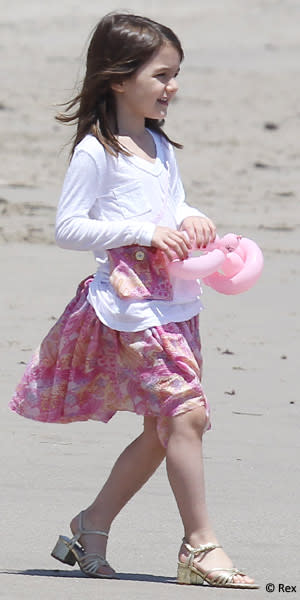 Sandals? On the beach? Say it ain't so! Alas every young fashionista makes a misstep in the early days of her style career. We think we'll let this one pass because, well, she's six. (Los Angeles, May 2011)