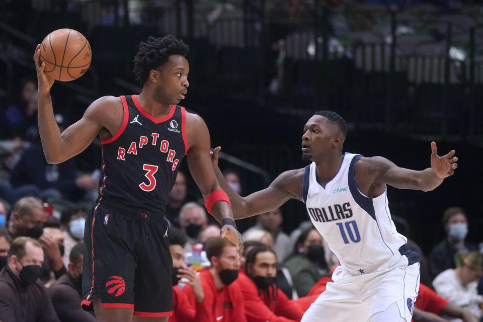 Toronto Raptors forward OG Anunoby (3) keeps the ball from Dallas Mavericks defender Dorian Finney-Smith (10) during the first quarter of an NBA basketball game in Dallas, Wednesday, Jan. 19, 2022. (AP Photo/LM Otero)