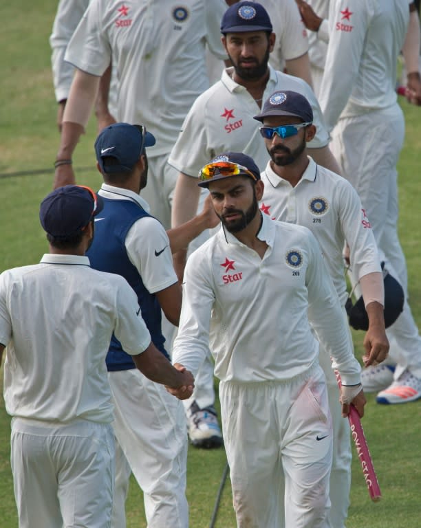 India's Virat Kohli shakes hands with teammates on July 24, 2016