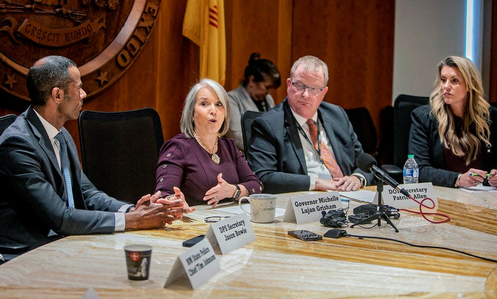 New Mexico Gov. Michelle Luján Grisham, center left, speaks during a press conference and provides updates on ongoing investigations following an alleged case of severe abuse and neglect of a developmentally disabled adult, at the state capitol on Monday, March 20, 2023, in Santa Fe, N.M.