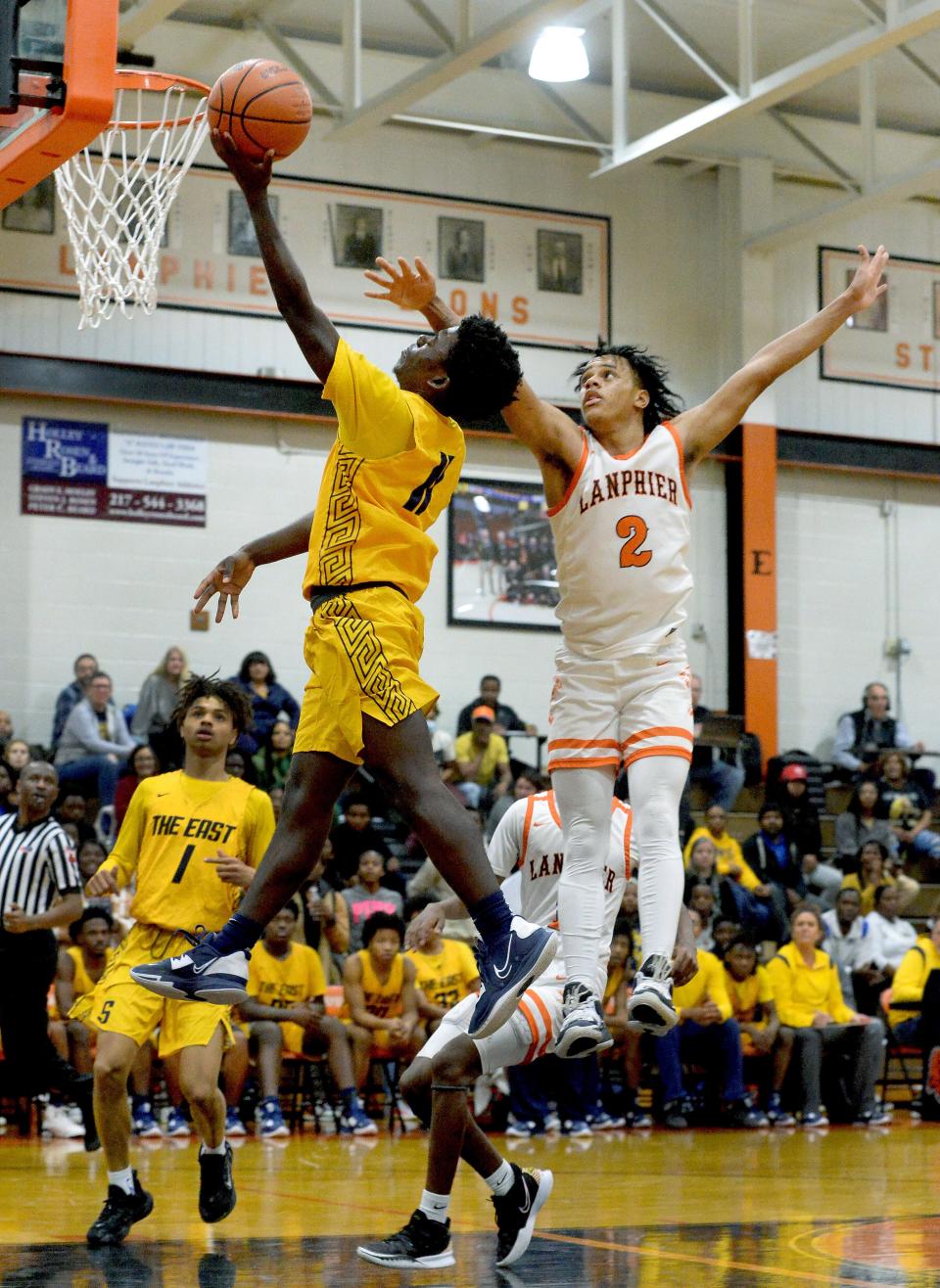 Southeast High School's James Folayan, left, goes up for a shot while being guarded by Lanphier's Jessie Bates III during the game Tuesday Dec. 6. 2022.