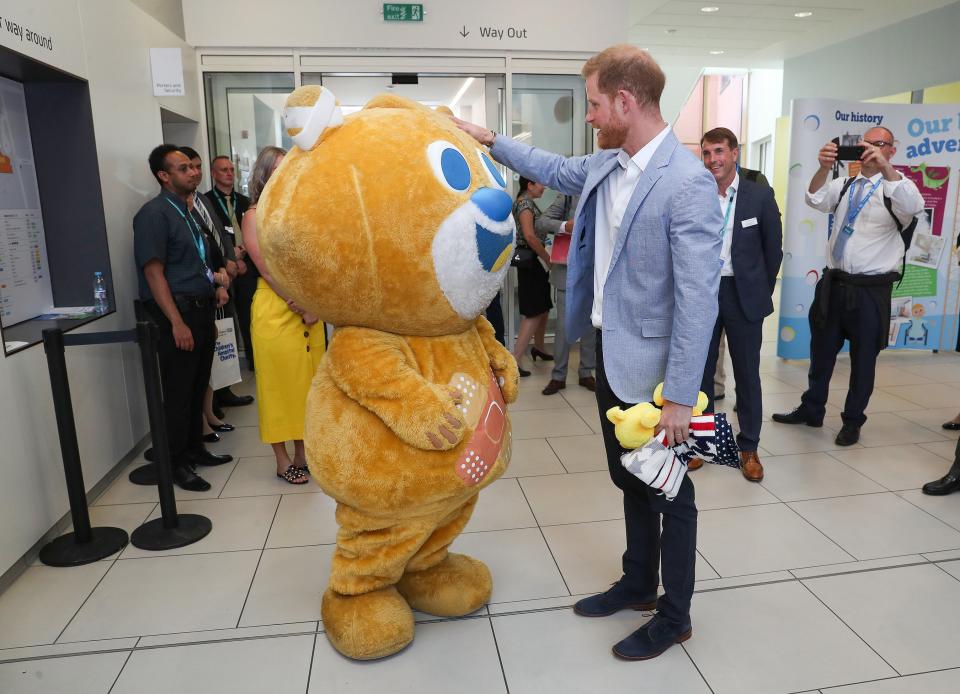 Austin wanted to tell Prince Harry about his mom — however, she was wearing the costume for the hospital’s mascot, Theo! 