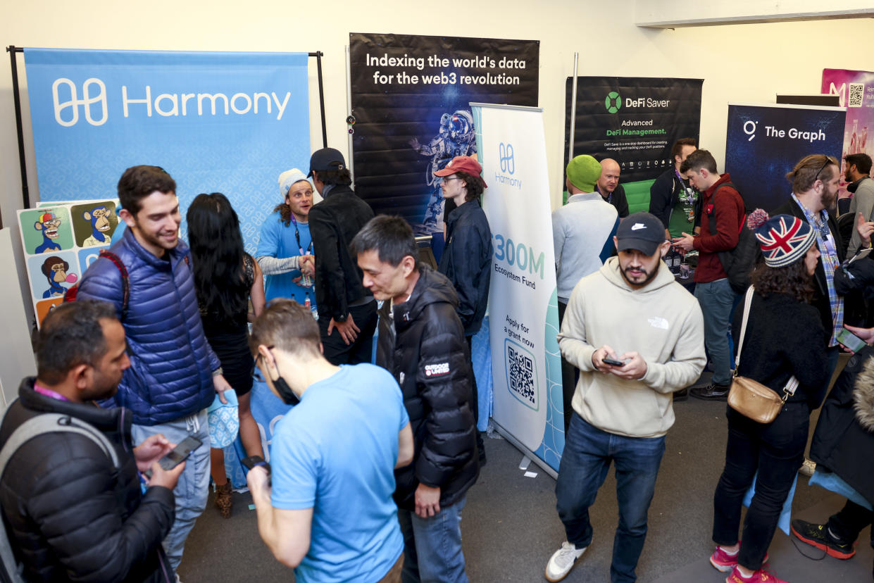 DENVER, CO - FEBRUARY 18: People visit booths at ETHDenver on February 18, 2022 in Denver, Colorado.  ETHDenver is the largest and longest-running Ethereum Blockchain event in the world with more than 15,000 cryptocurrency devotees attending the week-long meeting.  (Photo by Michael Ciaglo/Getty Images)