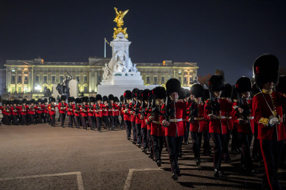 Members of the military march near Buckingham Palace in central London, Tuesday, May 2, 2023 during a rehearsal for the coronation of King Charles III which will take place at Westminster Abbey on May 6. (AP Photo/Vadim Ghirda)