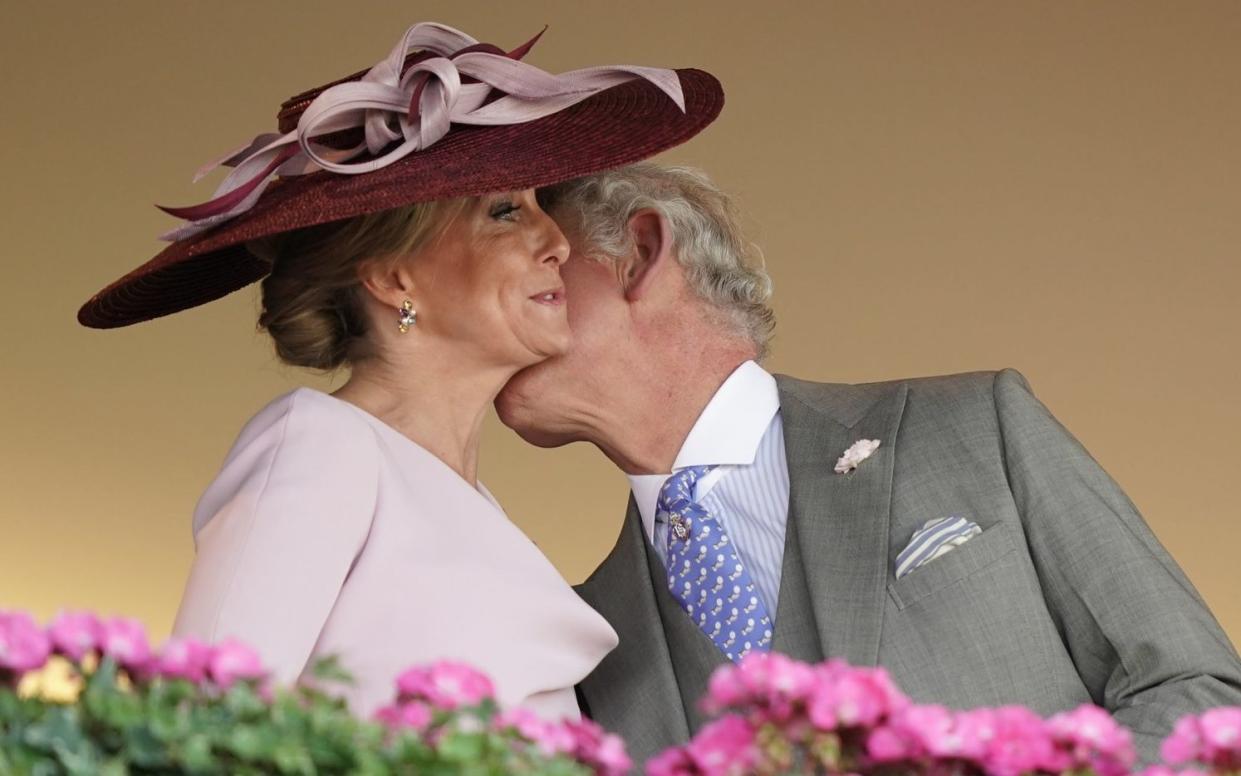 The Prince of Wales greets the Countess of Wessex with a kiss during day one of Royal Ascot on June 14 - PA