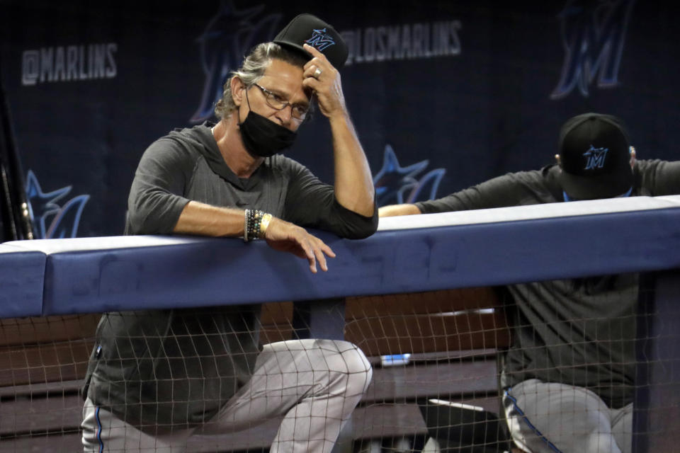 FILE - In this Sunday, July 12, 2020, file photo, Miami Marlins manager Don Mattingly watches a baseball scrimmage at Marlins Park in Miami. The Marlins, one of the most under-the-radar teams in sports, have making news lately, all of it bad. Overtaken by a coronavirus outbreak, the team must scramble for roster replacements as they try salvage a season barely underway. (AP Photo/Lynne Sladky, File)