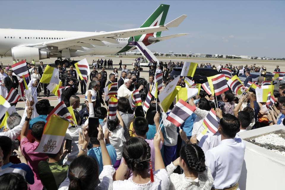 Pope Francis waves as he arrives at Military Air Terminal of Don Muang Airport, Wednesday, Nov. 20, 2019, in Bangkok, Thailand. (AP Photo/Gregorio Borgia)