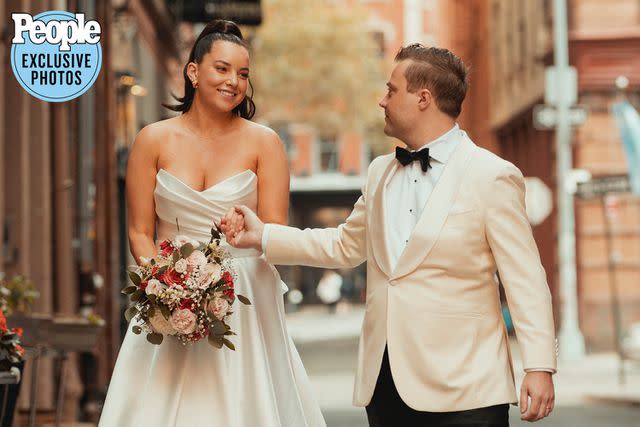 <p>Alfonso Lozano</p> Ciara Schirripa and Zach Binder hold hands on their wedding day.