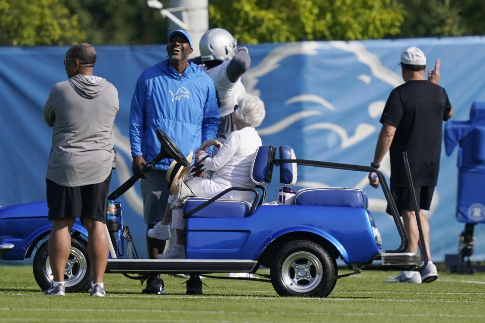 Detroit Lions General Manager Brad Holmes laughs as he talks with team Chair Emeritus/Owner Martha Firestone Ford during drills at the Lions NFL football camp practice, Wednesday, July 28, 2021, in Allen Park, Mich. (AP Photo/Carlos Osorio)