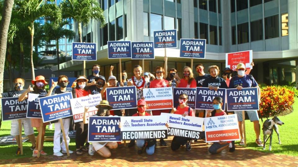 <div class="inline-image__caption"><p>Tam supporters out campaigning.</p></div> <div class="inline-image__credit">Courtesy Adrian Tam</div>