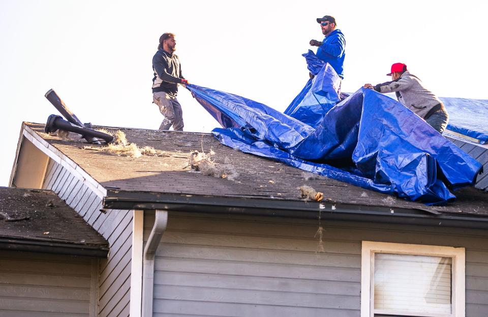 Teams were hard at work Sunday at Saddleworth Green apartments in southwest Ocala.