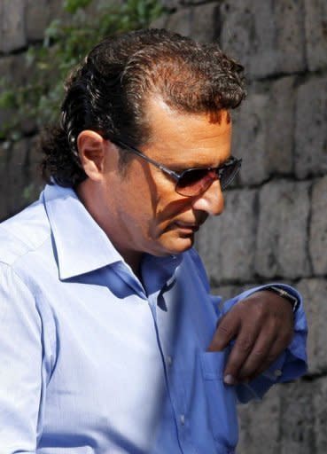 Former Costa Concordia captain Francesco Schettino in Meta di Sorrento on October 14. Schettino is accused of abandoning ship before its evacuation was complete. He has claimed he fell onto a lifeboat when the ship keeled over. Europe's top cruise operator has come under pressure at pre-trial hearings into the Costa Concordia disaster as Schettino faced survivors for the first time