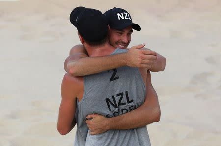 Beach Volleyball - Gold Coast 2018 Commonwealth Games - Men's Bronze Medal Match - England v New Zealand - Coolangatta Beachfront - Gold Coast, Australia - April 12, 2018. Ben O'Dea and Sam O'Dea of New Zealand celebrate. REUTERS/Athit Perawongmetha