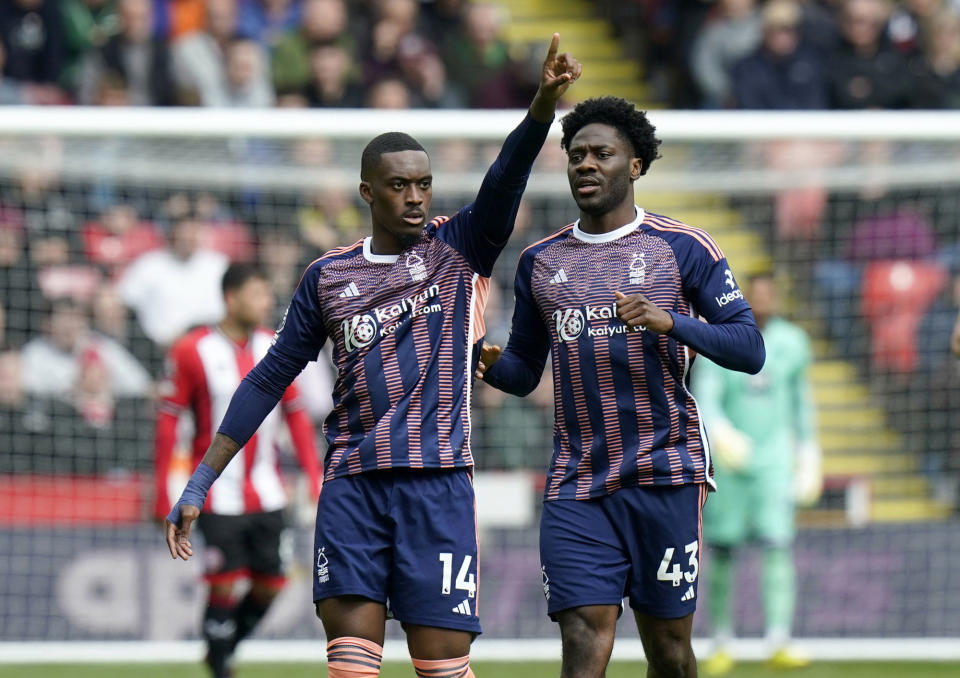 Nottingham Forest's Callum Hudson-Odoi, left, celebrates after scoring his side's first goal of the game, during the English Premier League soccer match between Sheffield United and Nottingham Forest, at Bramall Lane, in Sheffield, England, Saturday May 4, 2024. (Danny Lawson/PA via AP)