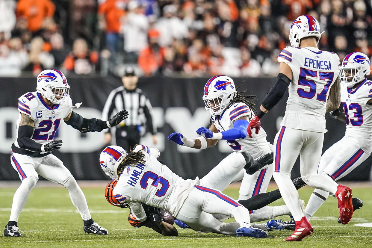 Image: Cincinnati Bengals wide receiver Tee Higgins (85) collides with Buffalo Bills safety Damar Hamlin (3) during the first half of an NFL football game on Jan. 2, 2023, in Cincinnati. (Joshua A. Bickel / AP)