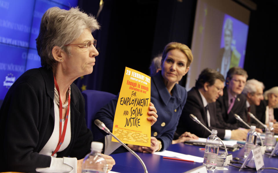 Secretary General of the European Trade Union Confederation Bernadette Segol, left, holds up a paper while speaking during a media conference at an EU summit in Brussels on Thursday, March 1, 2012. European leaders meet for a two-day summit aimed at tackling unemployment and boosting economic growth in the region. From left, Denmark's Prime Minister Helle Thorning-Schmidt, European Commission President Jose Manuel Barroso, EU Commissioner for Employment Laszlo Andor and Secretary General of Business Europe Philippe Buck. (AP Photo/Virginia Mayo)