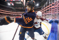 Colorado Avalanche' Devon Toews (7) and Edmonton Oilers' Evander Kane (91) battle on the corner during the second period of Game 3 of the NHL hockey Stanley Cup playoffs Western Conference finals, Saturday, June 4, 2022, in Edmonton, Alberta. (Jason Franson/The Canadian Press via AP)