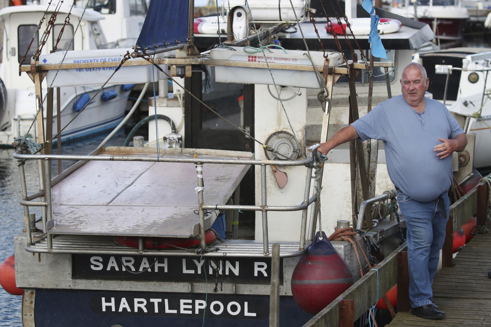 Fisherman Stan Rennie is pictured by his fishing vessel in Hartlepool, England, Thursday June. 27, 2024. A lot of politicians have promised change to voters in Hartlepool, a wind-whipped port town in northeast England. “At the last election I voted Conservative because Johnson promised our waters back — and lied through his teeth,” said Stan Rennie, a fisherman who has caught lobster off Hartlepool for five decades but says he can scarcely scrape a living anymore. (AP Photo/Scott Heppell)