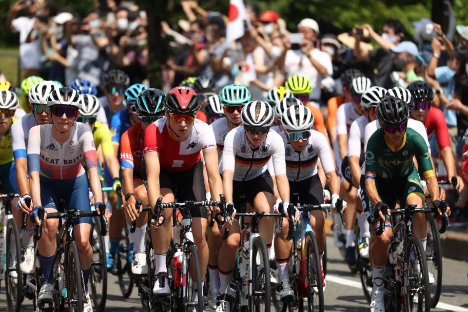 ride in the peloton during the women's cycling road race of the Tokyo 2020 Olympic Games after the race start Musashinonomori Park on the outskirts of Tokyo, Japan, on July 25, 2021. (Photo by MICHAEL STEELE / POOL / AFP) (Photo by MICHAEL STEELE/POOL/AFP via Getty Images)