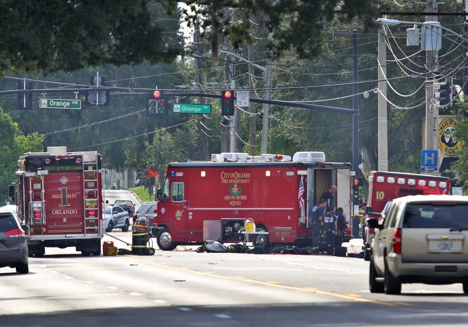 <p>Police and rescue officers monitor the scene of a shooting at Pulse nightclub in Orlando, June 12, 2016. (EPA/CRISTOBAL HERRERA) </p>