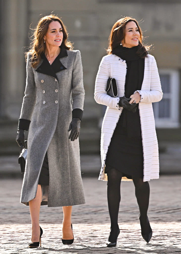 Kate Middleton and Crown Princess Mary of Denmark walking across the Amalienborg Courtyard in Copenhagen on Feb. 23, 2022. - Credit: SplashNews.com