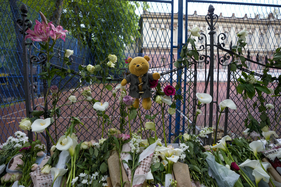 Flowers and toys are placed for the victims near the Vladislav Ribnikar school in Belgrade, Serbia, Thursday, May 4, 2023. A 13-year-old who opened fire Wednesday at his school in Serbia's capital. He killed multiple fellow students and a guard before calling the police and being arrested. Several children and a teacher were also hospitalized. (AP Photo/Darko Vojinovic)