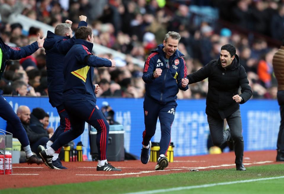 Arsenal manager Mikel Arteta (right) celebrates his sides third goal scored by Jorginho during the Premier League match at Villa Park (PA)