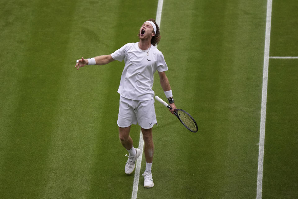 Russia's Andrey Rublev reacts after winning a point against Serbia's Novak Djokovic in a men's singles match on day nine of the Wimbledon tennis championships in London, Tuesday, July 11, 2023. (AP Photo/Alberto Pezzali)