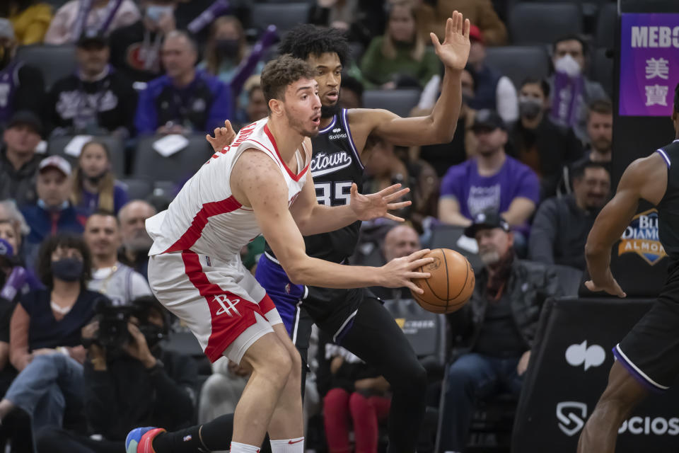 Sacramento Kings forward Marvin Bagley III (35) guards Houston Rockets center Alperen Sengun during the second half of an NBA basketball game in Sacramento, Calif., Friday, Jan. 14, 2022. The Kings won 126-114. (AP Photo/Randall Benton)