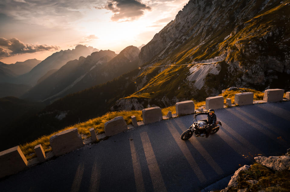 Man riding motorcycle on mountain road