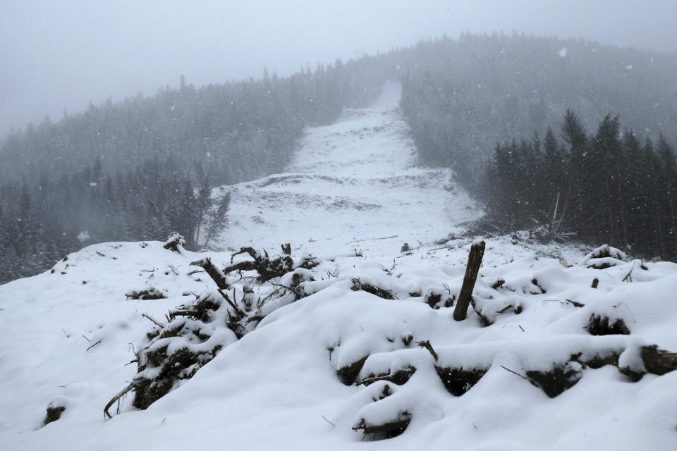 Snow on Tuesday, Feb. 27, 2024, covers the site of a deadly landslide in Wrangell, Alaska. In some ways, life in the small southeast Alaska community is returning to normal after the November 2023 landslide, but in others, the recovery is far from complete. (AP Photo/Becky Bohrer)