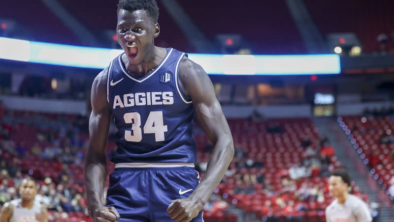 Utah State forward Kalifa Sakho yells after his teammate, forward Great Osobor, not pictured, made a basket while being fouled against UNLV Saturday, Jan. 13, 2024, in Las Vegas. The surprising No. 16 Aggies have been the talk of the Mountain West Conference this season.