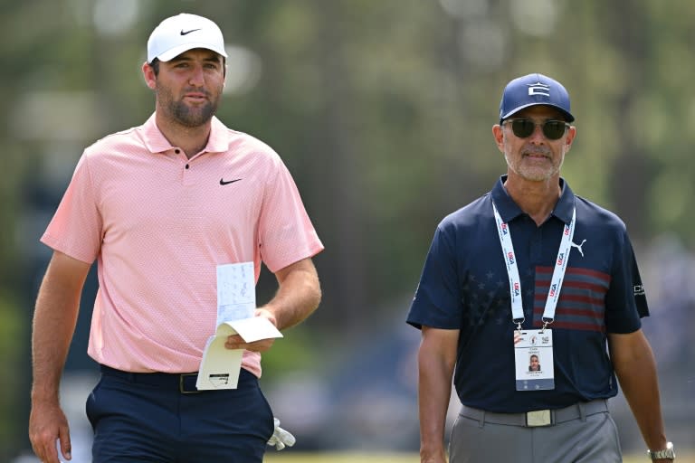 World number one Scottie Scheffler, left, walks with golf instructor Claude Harmon III on the fourth hole during a practice round ahead of Thursday's start of the 124th US Open at Pinehurst (ROSS KINNAIRD)