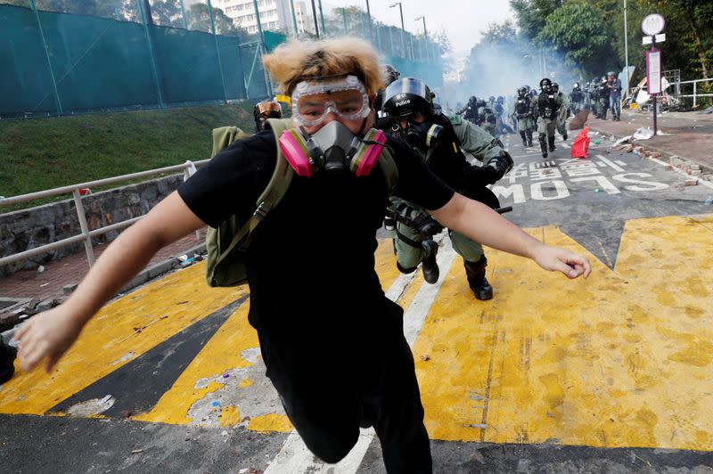 Pictures of the Year: Hong Kong protest tide turns into sea of flames