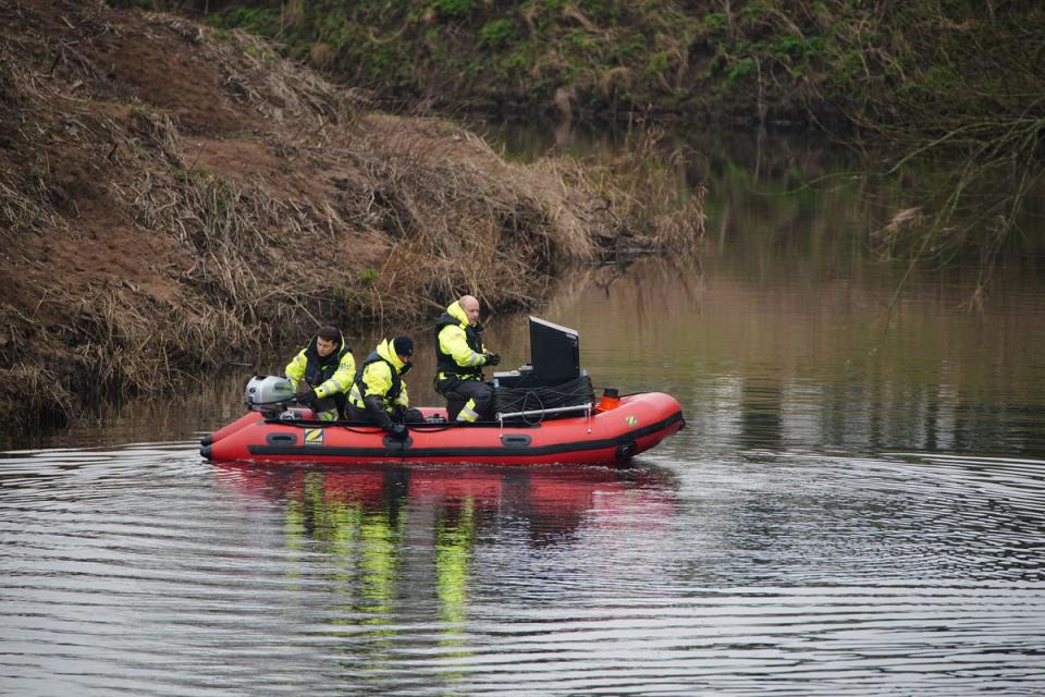 Workers from a private underwater search and recovery company, Specialist Group International, including CEO Peter Faulding (right) in St Michael's on Wyre on Tuesday (PA)