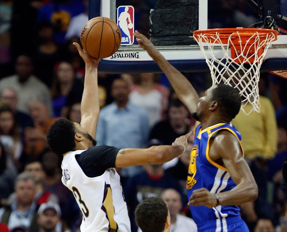 Kevin Durant shows Anthony Davis that he's a rim protector, too. (AP)