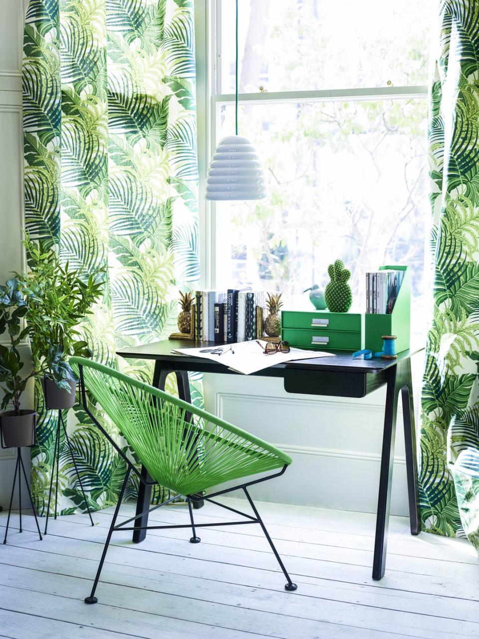 modern office area with tropical print curtains