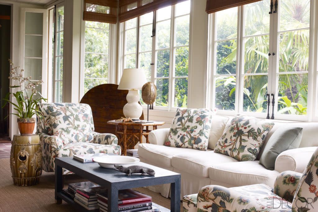 julia reed new orleans house sunroom with large windows and botanical printed couch cushions