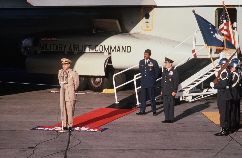 Captain Jeremiah Denton addresses the crowd welcoming repatriated POWs home at Travis AFB, Calif., on Feb. 18, 1973. Visible standing behind him is Major General Daniel "Chappie" James, USAF.